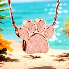 A rose gold paw print pendant filled with pink sparkle.