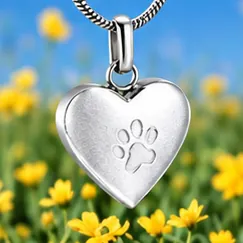 A brushed silver heart pendant with an etched paw print.